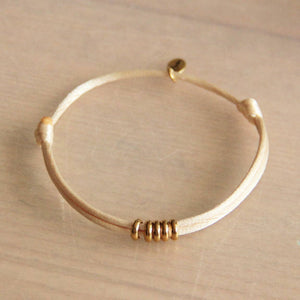 Satin bracelet with rings – sand colored / gold