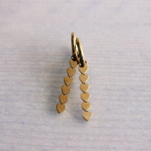 Steel hoop earrings with elongated heart tags - gold