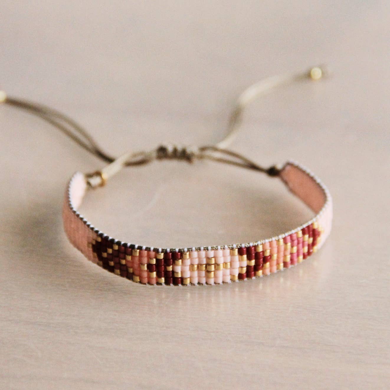 Weaving bracelet light pink/red/pink/gold plated